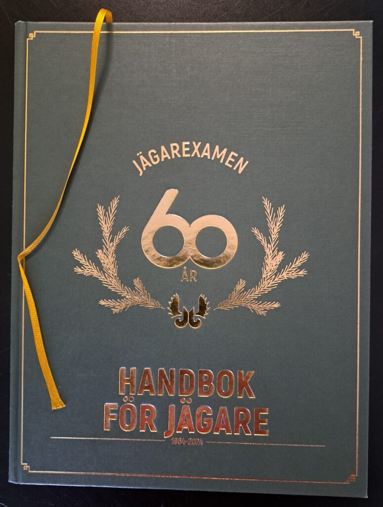 Omslagen som gjordes till handboken det 60:e jubileumsåret.